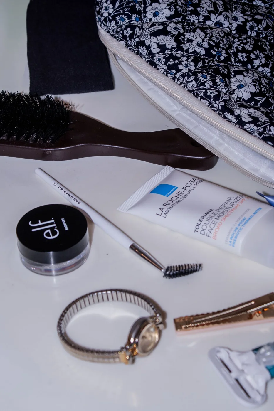 A floral cosmetic bag with everyday beauty essentials